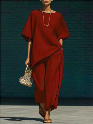 Burgundy two-piece set with contrast trim, half sleeves, and wide-leg pants.