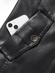 Black faux leather jacket with buttoned pocket detail and visible phone.