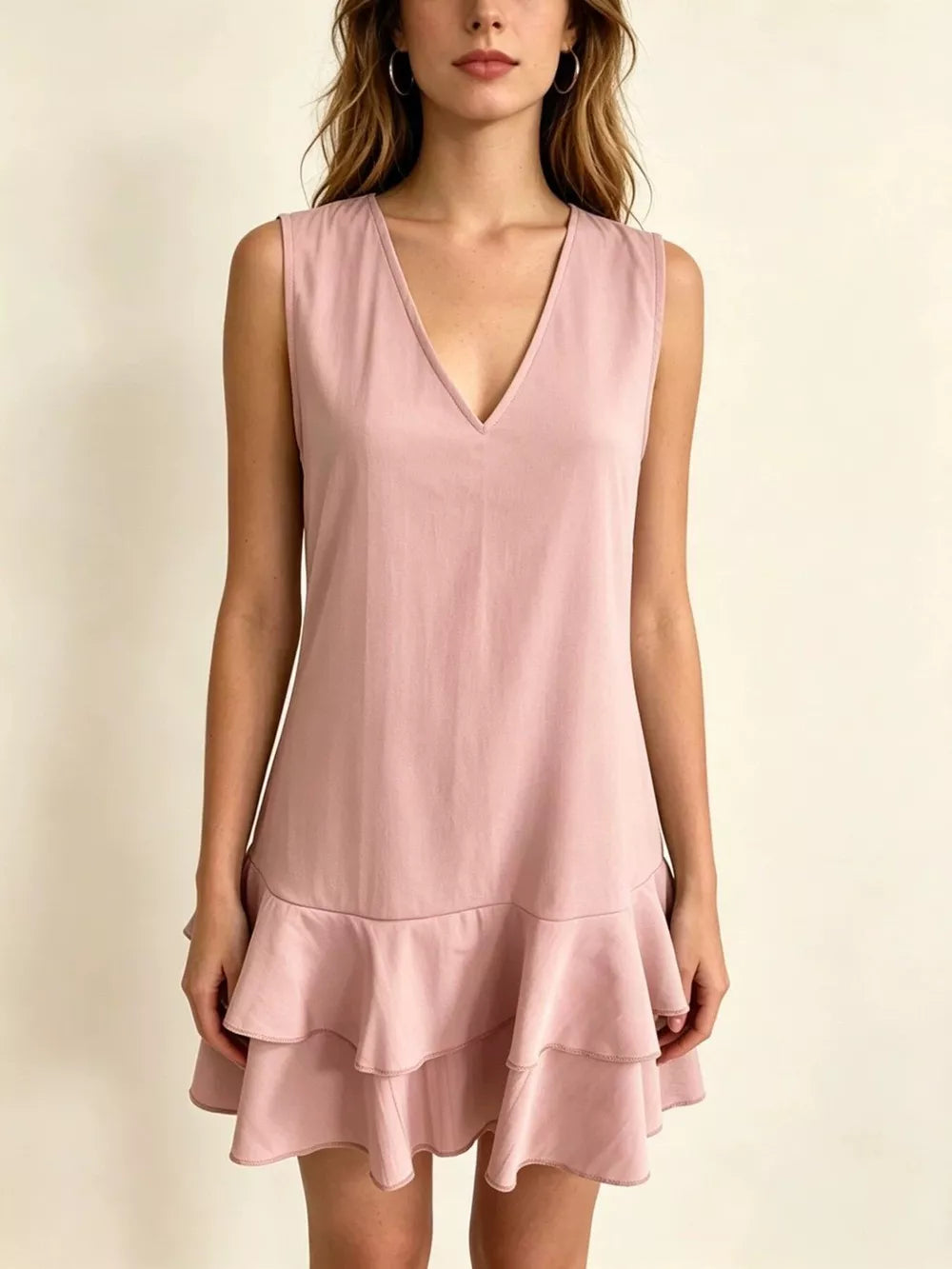 Lotus Color tiered ruffle mini dress with V-neck and sleeveless design.