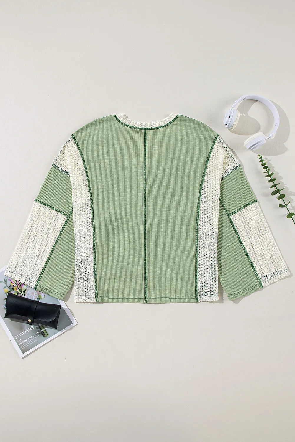 Textured patchwork tunic top in gum leaf green with white crochet sleeves and V-neck.