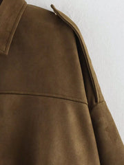 Brown oversized zip-up jacket with shoulder detail and collar.