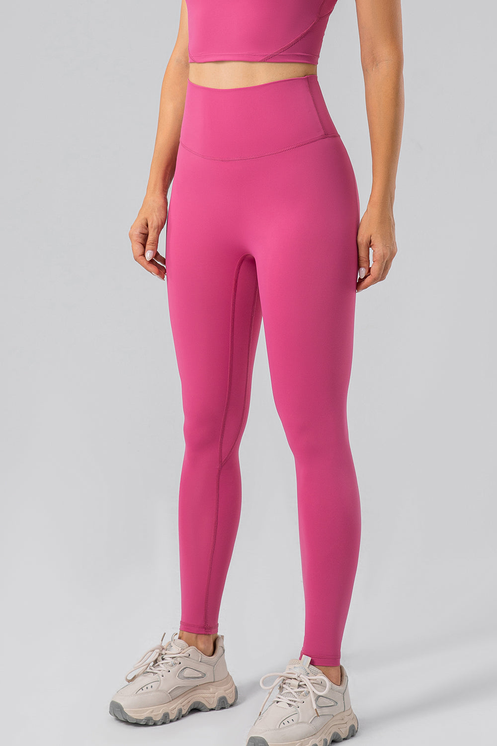 Hot Pink high-waist performance leggings with a sculpted contour fit and seamless detailing.