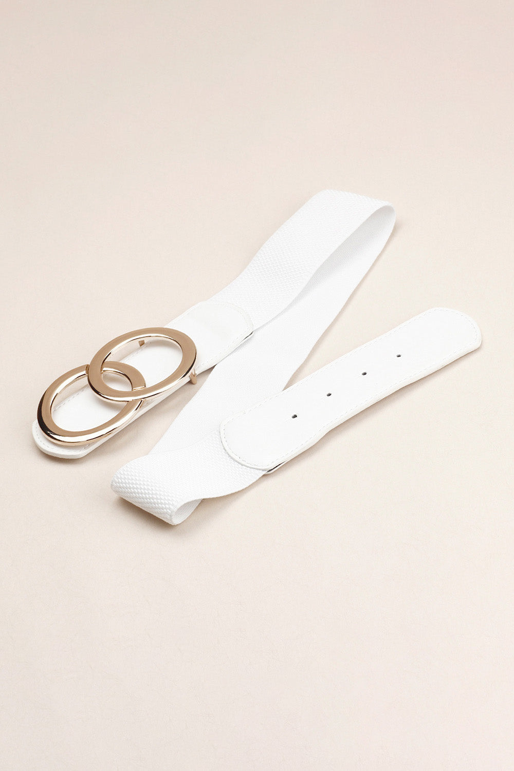 White stretch belt with interlocking gold rings and buckle closure