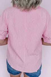 Pink and white striped collared v-neck blouse with short sleeves.